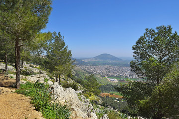 Fototapeta na wymiar view of the Jezreel Valley, biblical Mount Tabor and the Arab villages at its foot, neighborhood Nazareth, Israel