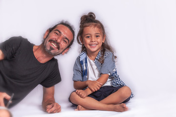 a long hair boy and his father action in Thaisign studio Phuket on white background.