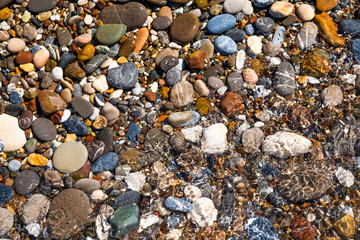 Beautiful pebbles on the beach close up