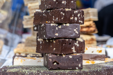 Home made chocolate with dried nuts displayed for sale at a street food market