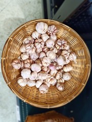 Fresh garlic placed in a spherical basket