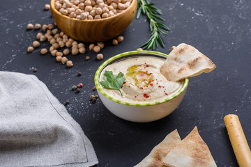 Homemade hummus with pita and grissini bread sticks. Middle Eastern traditional and authentic arab...