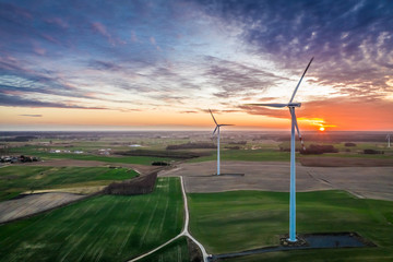 Fototapeta na wymiar Aerial view of stunning wind turbines at dusk
