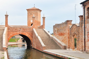 Fototapeta na wymiar Comacchio, Italy. View of the historic bridge Trepponti.
