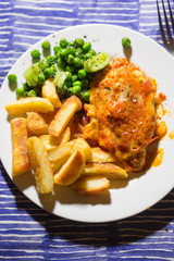 Chicken with cheese and tomato sauce & fries & peas 