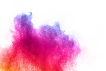 abstract powder splatted background. Colorful powder explosion on white background. Colored cloud....