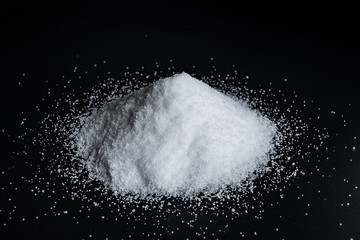 Fine salt on black background