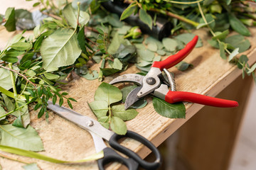 Close-up of tools Professional florist. Arrangement and packaging of the bouquet. The concept of flower delivery and online store