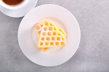 Homemade waffles with icing sugar