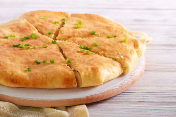 Savory pie with cheese and spring onions