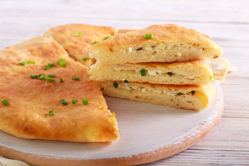 Savory pie with cheese and spring onions