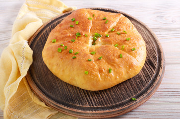 Savory pie with cheese and spring onions
