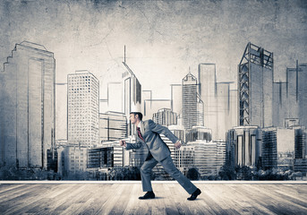 King businessman in elegant suit running and drawn cityscape silhouette at background