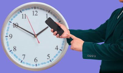 Business man hold a smart phone with analog clock  ,business concept.