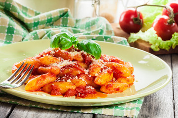 Italian gnocchi with tomato sauce and cheese
