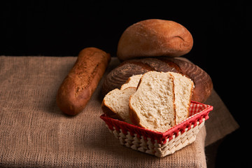 breads and baguette concept of teasty home food close up on table