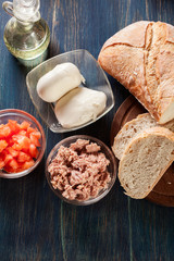 Ingredients ready for preparing bruschetta with tuna, mozzarella