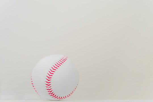 Baseball on table with white background