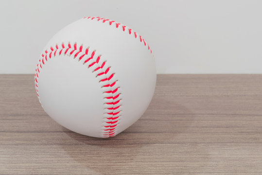 Baseball on table with white background