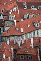 Fototapeta na wymiar The red tiled roofs of Prague houses