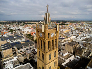 Fototapeta na wymiar Aerial View of Close Up of the Bell Tower of the Church Santa Maria La Nova in Pulsano near Taranto