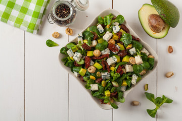 Italian salad with avocado, gorgonzola cheese.