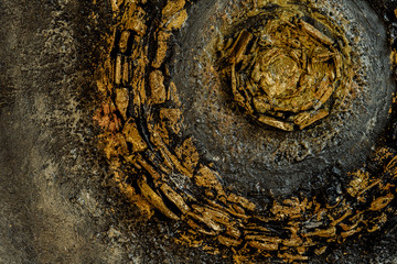stucco on black canvas of coal and paint