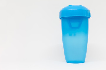 Closed blue shaker on a white background
