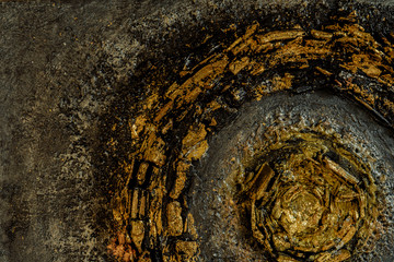 stucco on black canvas of coal and paint