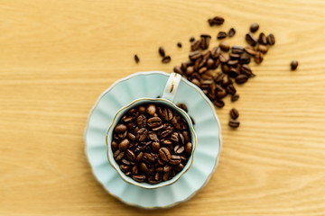 Coffee cup and beans on a background