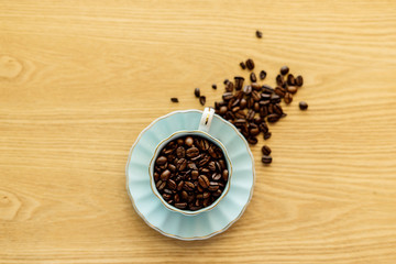 Coffee cup and beans on a background