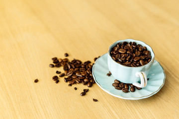 Coffee cup and beans on a background