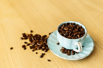 Coffee cup and beans on a background