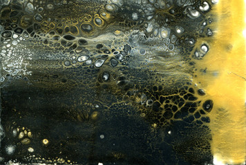 Very beautiful texture background. Black paint flows in gold with the addition of white paint. Style includes curls of marble or agate with bubbles and cells. Natural style.  Contemporary art. 