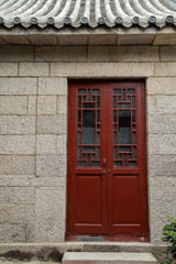 red door with rock house in chinises style