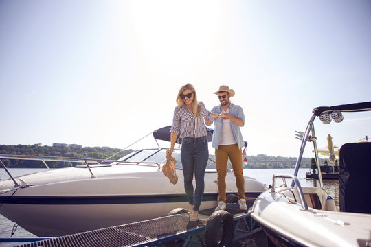 Bearded handsome young man brought his girlfriend to the river to show her the surprise.