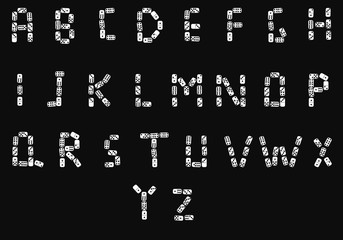 English alphabet made from domino bones.Isolated on black