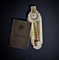 Soviet passport and thermometer