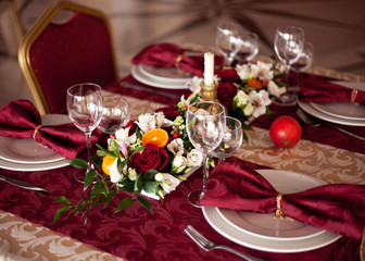 Table setting set with candles and flowers
