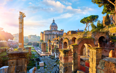Roman Forum in Rome, Italy. Antique structures with columns and archs. Wrecks of ancient italian roman town. Church of Santi Luca e Martina. Sunrise above famous architectural landmark. - obrazy, fototapety, plakaty