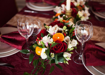 Table setting set with candles and flowers