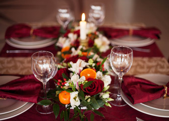 Table setting set with candles and flowers