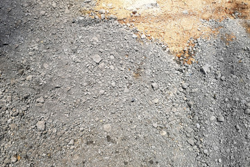 Small crushed rocks or gravel used for construction of buildings or road.