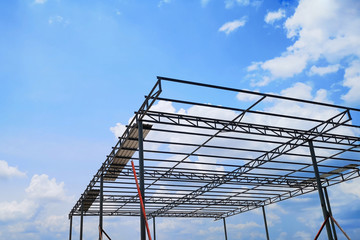 Small steel structure garage bright sky background and empty space for text.