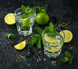 Mojito cocktail with Rum, lime and mint in glass. Summer cold drink with ice