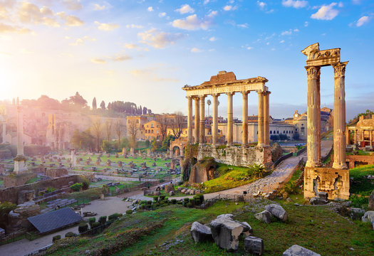 Roman Forum in Rome, Italy. Antique structures with columns. Wrecks of ancient italian roman town. Sunrise above famous architectural landmark.