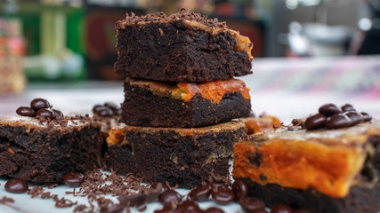 homemade chocolate brownies with toppings of grains and grated chocolate