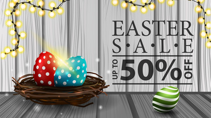 Easter sale, modern horizontal discount banner with wood texture, garland and Easter eggs in the nest