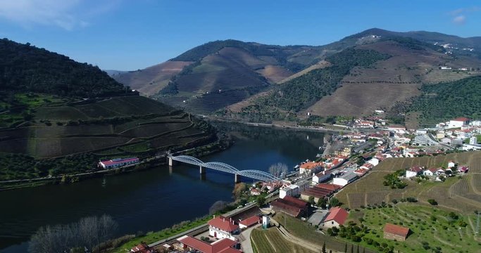 Aerial view of the Pinhao village with terraced vineyards and the Douro River, in Portugal; Concept for travel in Portugal and most beautiful places in Portugal