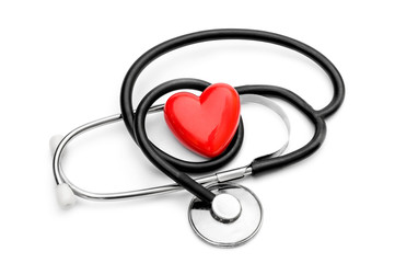 Stethoscope and red heart on white. Medical concept.